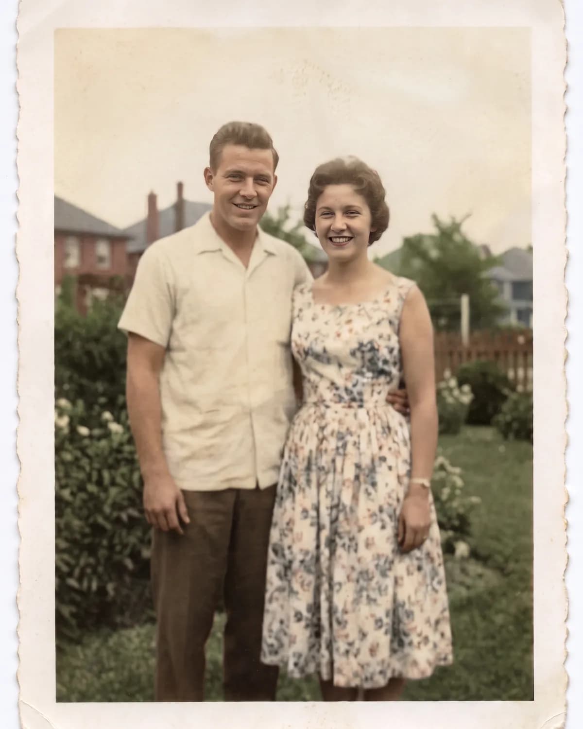 The same photograph repaired, sharpened and colourised, with its border and grain intact